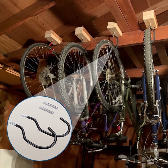 plusieurs velos suspendus par roues a l envers horizontalement par support velo mural dans grange au plafond