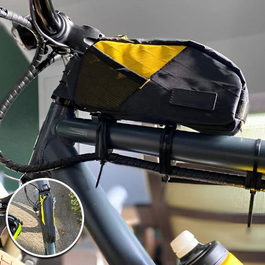 sac velo noir et jaune sur cadre velo de route