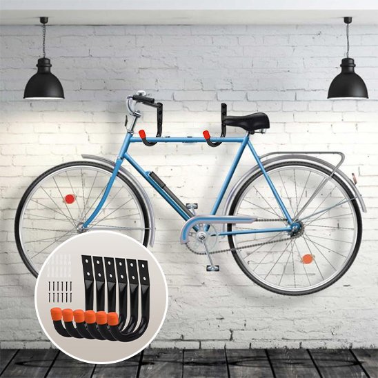 velo bleu suspendu sur mur de briques blanche horizontalement avec deux support mural pour velo