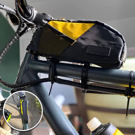 sac velo noir et jaune sur cadre velo de route
