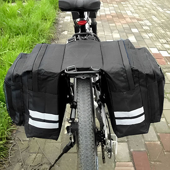 sacoche velo porte bagage sur velo route pavee