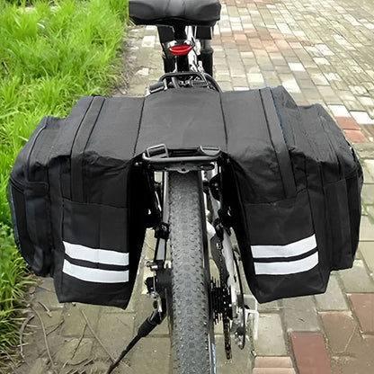 sacoche velo porte bagage sur velo route pavee