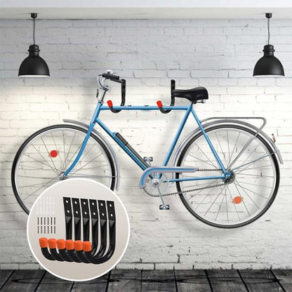 velo bleu suspendu sur mur de briques blanche horizontalement avec deux support mural pour velo