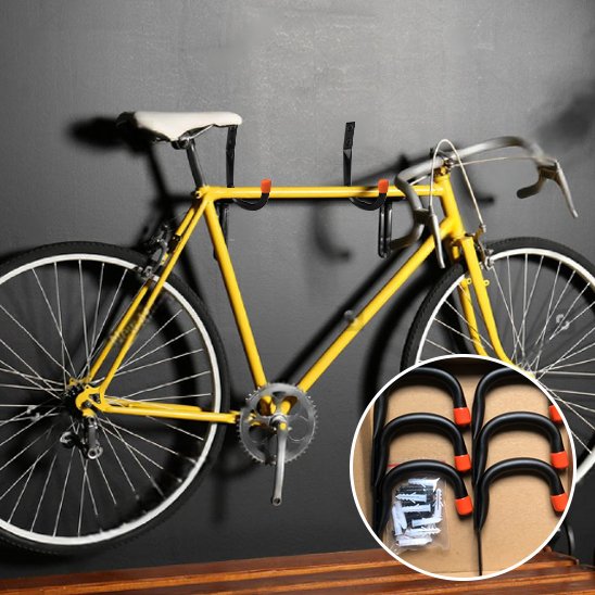 velo de course jaune suspendu sur mur gris par support mural pour velo
